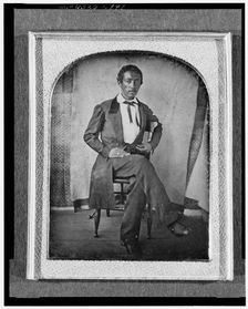 R. McGill, full-length portrait, seated in chair, facing front, with..., between 1840 and 1860. Creator: Unknown