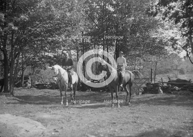 Rothbart, Albert, Mr., on horseback, with unidentified woman on horseback, between 1920 and 1935. Creator: Arnold Genthe.