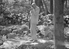 Rothbart, Albert, Mr., taking a photograph outdoors, between 1920 and 1935. Creator: Arnold Genthe