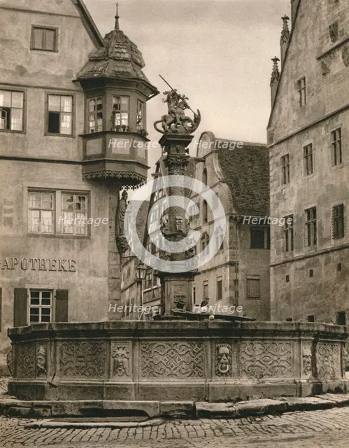 'Rothenburg o. d. T. - St. George's Fountain - Marien-Apotheke', 1931. Artist: Kurt Hielscher.