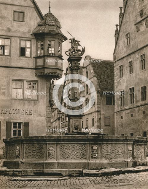 'Rothenburg o. d. T. - St. George's Fountain - Marien-Apotheke', 1931. Artist: Kurt Hielscher.
