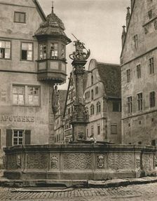 Rothenburg o. d. T. - St. George's Fountain - Marien-Apotheke 1931. Artist: Kurt Hielscher
