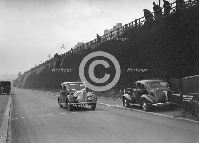 Rover saloon of A Corrie competing in the RAC Rally, Madeira Drive, Brighton, 1939. Artist: Bill Brunell.