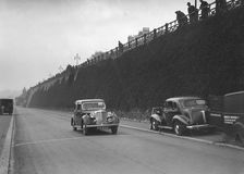 Rover saloon of A Corrie competing in the RAC Rally, Madeira Drive, Brighton, 1939. Artist: Bill Brunell