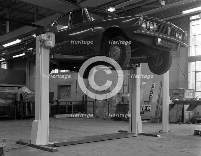 Rover P6 on a Laycock 4 post wheel free lift, Sheffield, South Yorkshire, 1968.  Creator: Michael Walters.