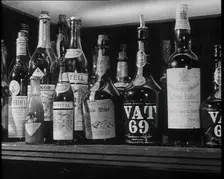 Row of Spirits Lined up on a Shelf, 1933. Creator: British Pathe Ltd