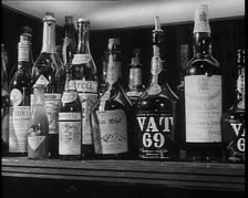 Row of Spirits Lined up on a Shelf, 1933. Creator: British Pathe Ltd