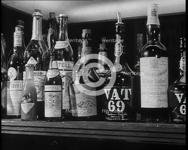 Row of Spirits Lined up on a Shelf, 1933. Creator: British Pathe Ltd.