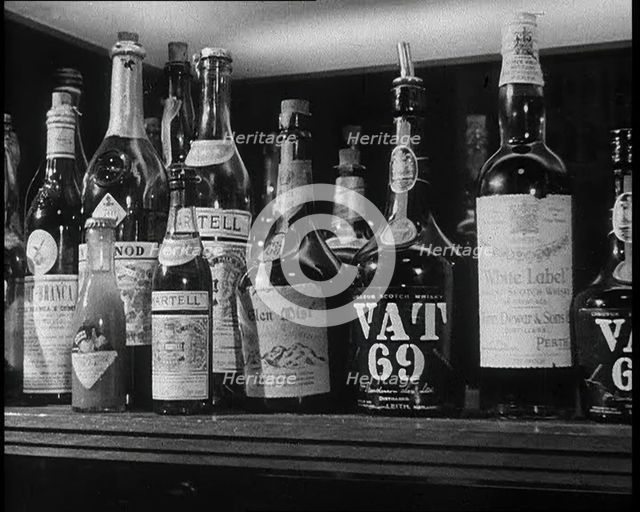 Row of Spirits Lined up on a Shelf, 1933. Creator: British Pathe Ltd.