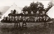 Rowntree boys at camp lie on a trestle,Coniston, Cumbria, summer 1913