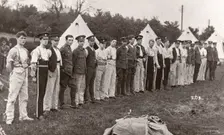 Rowntree boys line up for inspection outside their tents, Coniston, Cumbria, summer 1913