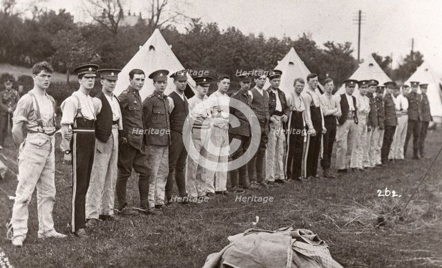 Rowntree boys line up for inspection outside their tents, Coniston, Cumbria, summer 1913. Artist: Unknown