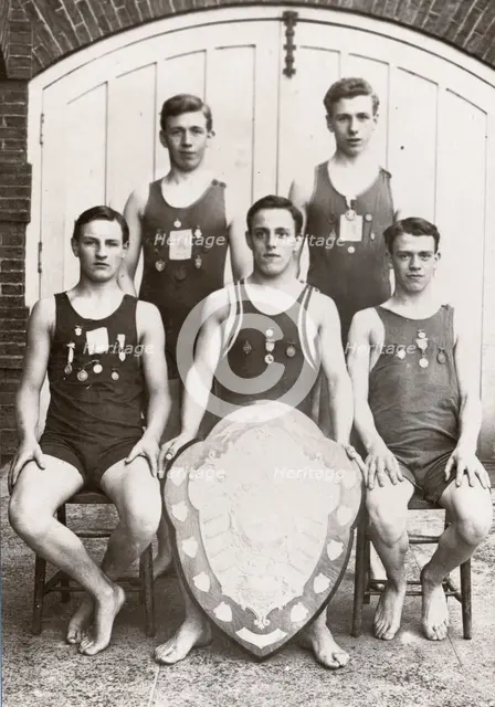 Rowntree boys life-saving team pose with the Faber Life-Saving Trophy, 1912. Artist: Unknown