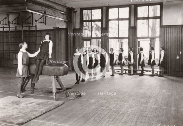 Rowntree girls in an indoor gymnastics class, 1930. Artist: Unknown