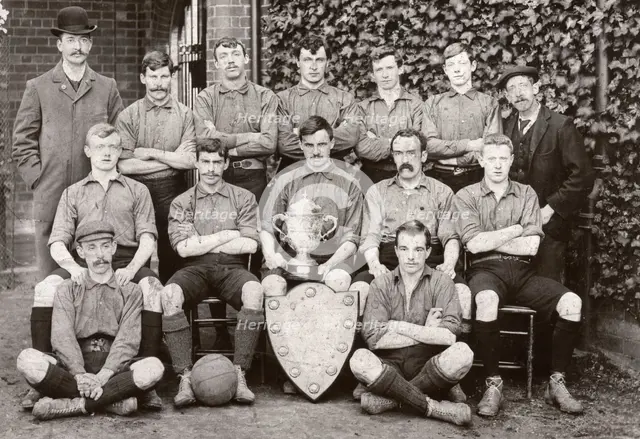 Rowntree Football Club 1st team pose with trophy and cup, York, Yorkshire, 1902. Artist: Unknown
