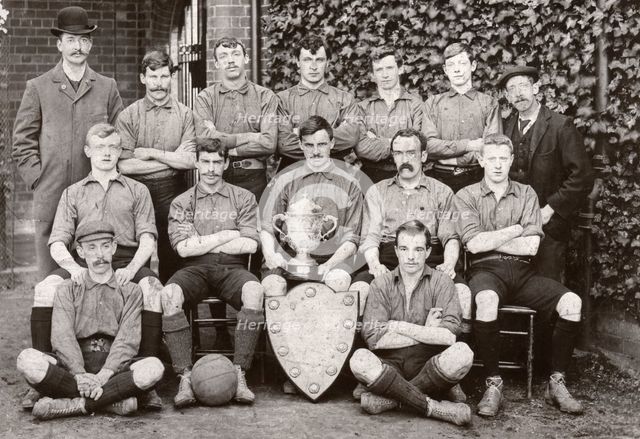 Rowntree Football Club 1st team pose with trophy and cup, York, Yorkshire, 1902. Artist: Unknown