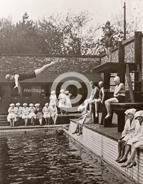 Rowntree factory workers sit around swimming pool, Yearsley baths, York,  Yorkshire, 1933. Artist: Unknown