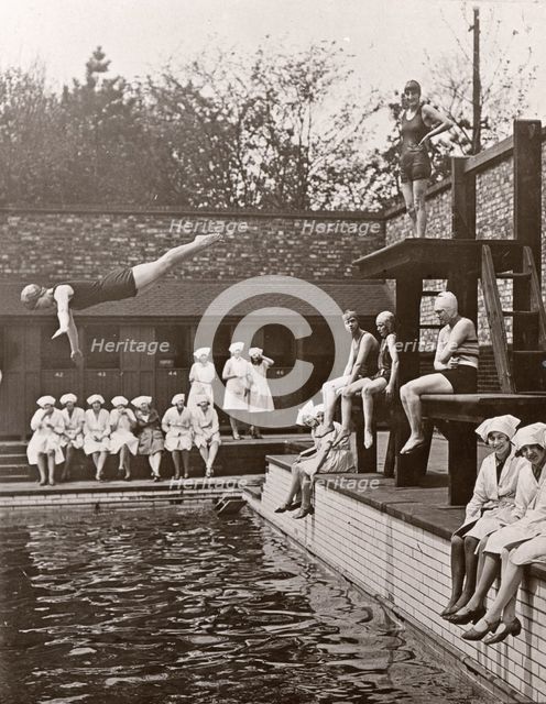 Rowntree factory workers sit around swimming pool, Yearsley baths, York,  Yorkshire, 1933. Artist: Unknown