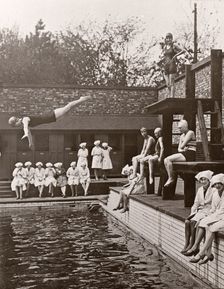 Rowntree factory workers sit around swimming pool, Yearsley baths, York, Yorkshire, 1933