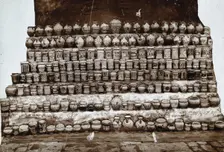 Rows of decorated pharmacy jars and other objects, c19th century. Creator: Unknown