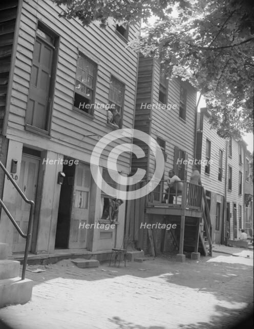 Rows of homes in the Southwest area, Washington, D.C, 1942. Creator: Gordon Parks.