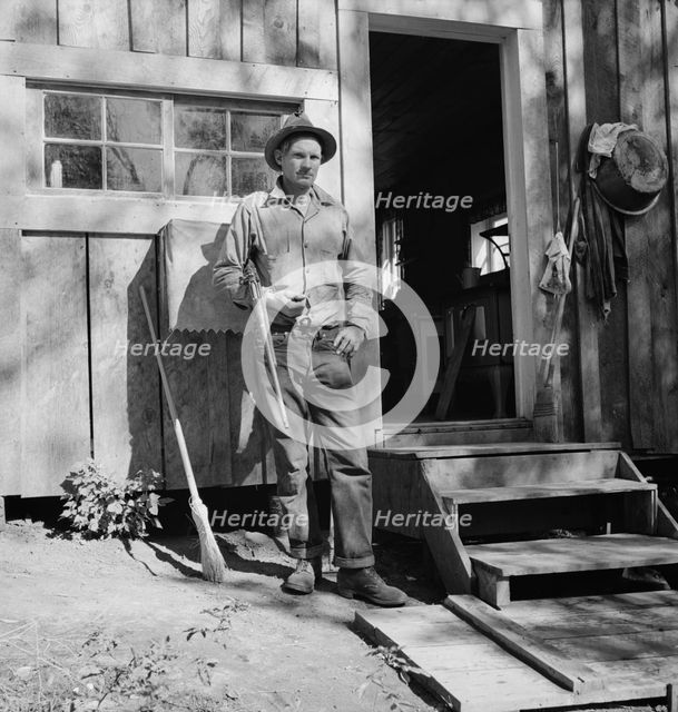Roy Carlock, member of Ola self-help sawmill co-op, Gem County, Idaho, 1939. Creator: Dorothea Lange.