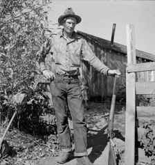 Roy Carlock, member of Ola self-help sawmill co-op, in front of his new..., Gem County, Idaho, 1939. Creator: Dorothea Lange