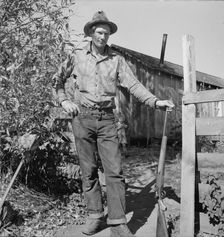 Roy Carlock, member of Ola self-help sawmill co-op, in front of his new..., Gem County, Idaho, 1939. Creator: Dorothea Lange
