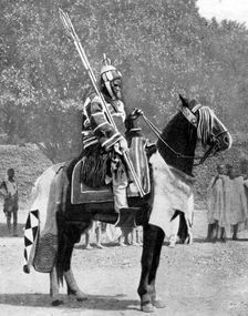 Royal bodyguard in ancient armour, northern Nigeria, 1936.Artist: Wide World Photos