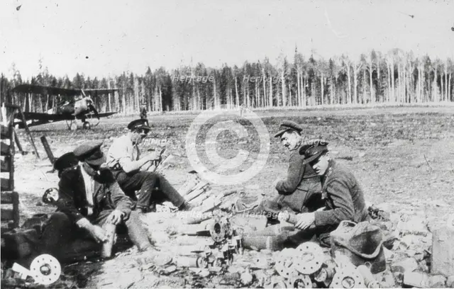 Royal Engineers Special Brigade officers and Thomas Davies’ servant assembling M bombs..., 1919. Creator: Unknown.