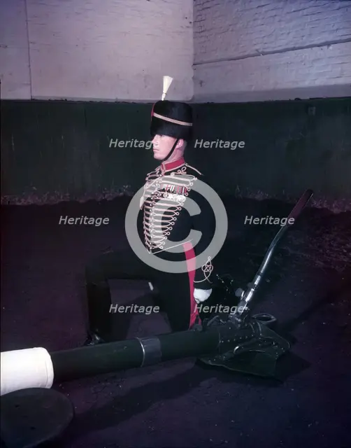 Royal Horse Artillery gun team in full dress, sergeant kneeling, c1953.  Creator: Arthur Charles Kirby Ware.
