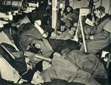 Royal Marines sleeping in the gunhouse of a warship, World War II, c1939-c1943 (1944). Creator: Unknown