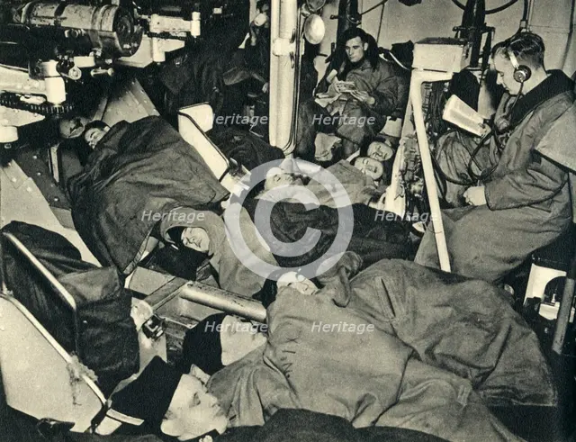 Royal Marines sleeping in the gunhouse of a warship, World War II, c1939-c1943 (1944). Creator: Unknown.