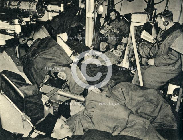 Royal Marines sleeping in the gunhouse of a warship, World War II, c1939-c1943 (1944). Creator: Unknown.