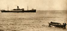 Royal navy cutter about to examine a ship's papers, First World War, 1914-1918, (1933). Creator: Unknown