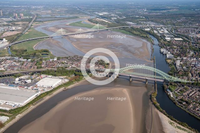 Road and rail bridges over the River Mersey and Manchester Ship Canal at Runcorn Gap, Halton, 2021. Creator: Damian Grady.