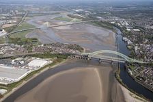 Road and rail bridges over the River Mersey and Manchester Ship Canal at Runcorn Gap, Halton, 2021. Creator: Damian Grady