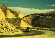 Road cut into the barren hills which lead into Emmett, Idaho, 1941. Creator: Russell Lee