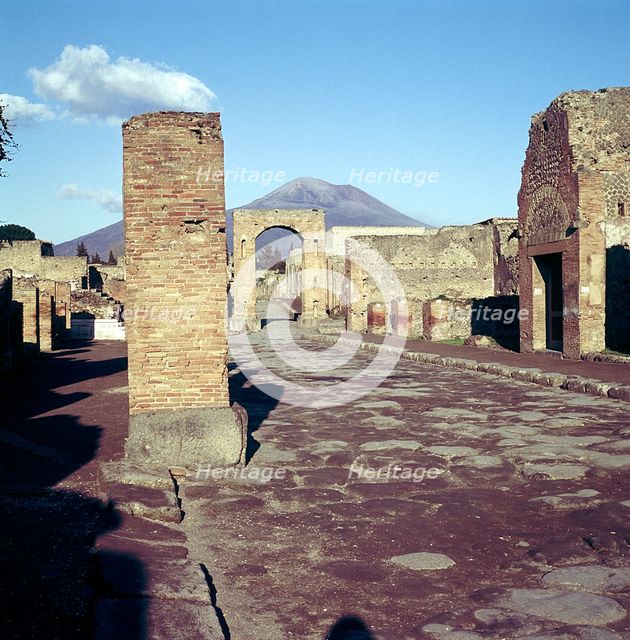 Road leading to Arch of Caligula with Vesuvius beyond, Pompeii, Italy. Creator: Unknown.