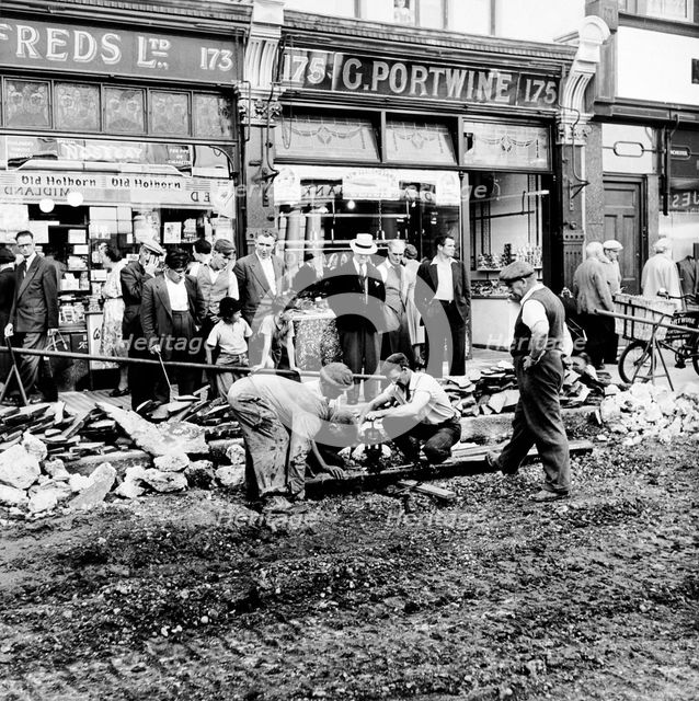 Road repairs in Portobello Road, London, c1956. Creator: Henry Grant.