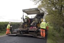 Road resurfacing work repairing potholes