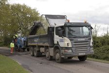 Road resurfacing work repairing potholes