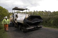 Road resurfacing work repairing potholes