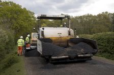 Road resurfacing work repairing potholes