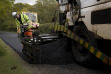 Road resurfacing work repairing potholes
