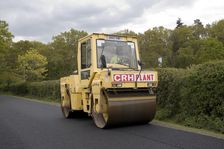 Road resurfacing work repairing potholes