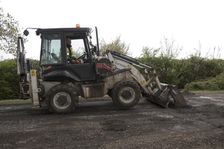 Road resurfacing work repairing potholes