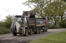 Road resurfacing work repairing potholes