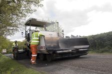 Road resurfacing work repairing potholes