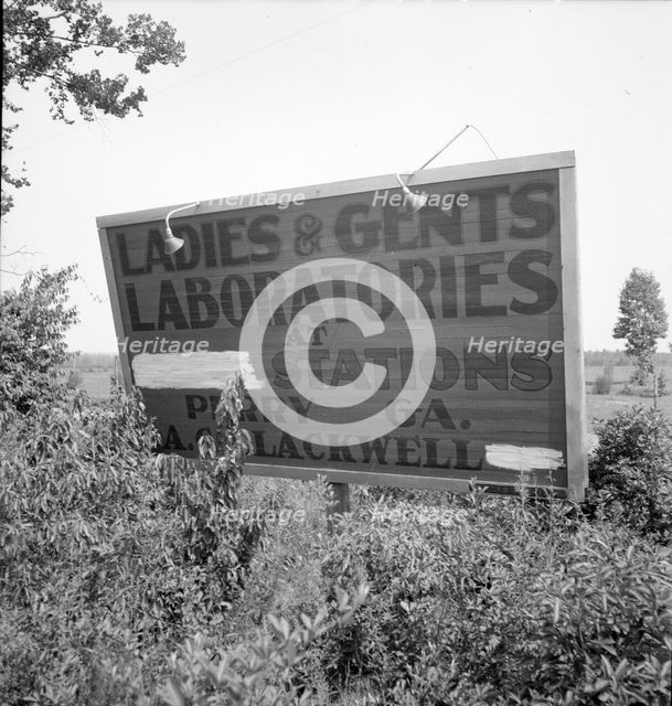 Road sign near Perry, Georgia, 1936. Creator: Dorothea Lange.